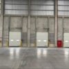Jenis dan Kegunaan Industrial Door dan Dock Leveler dalam Industri